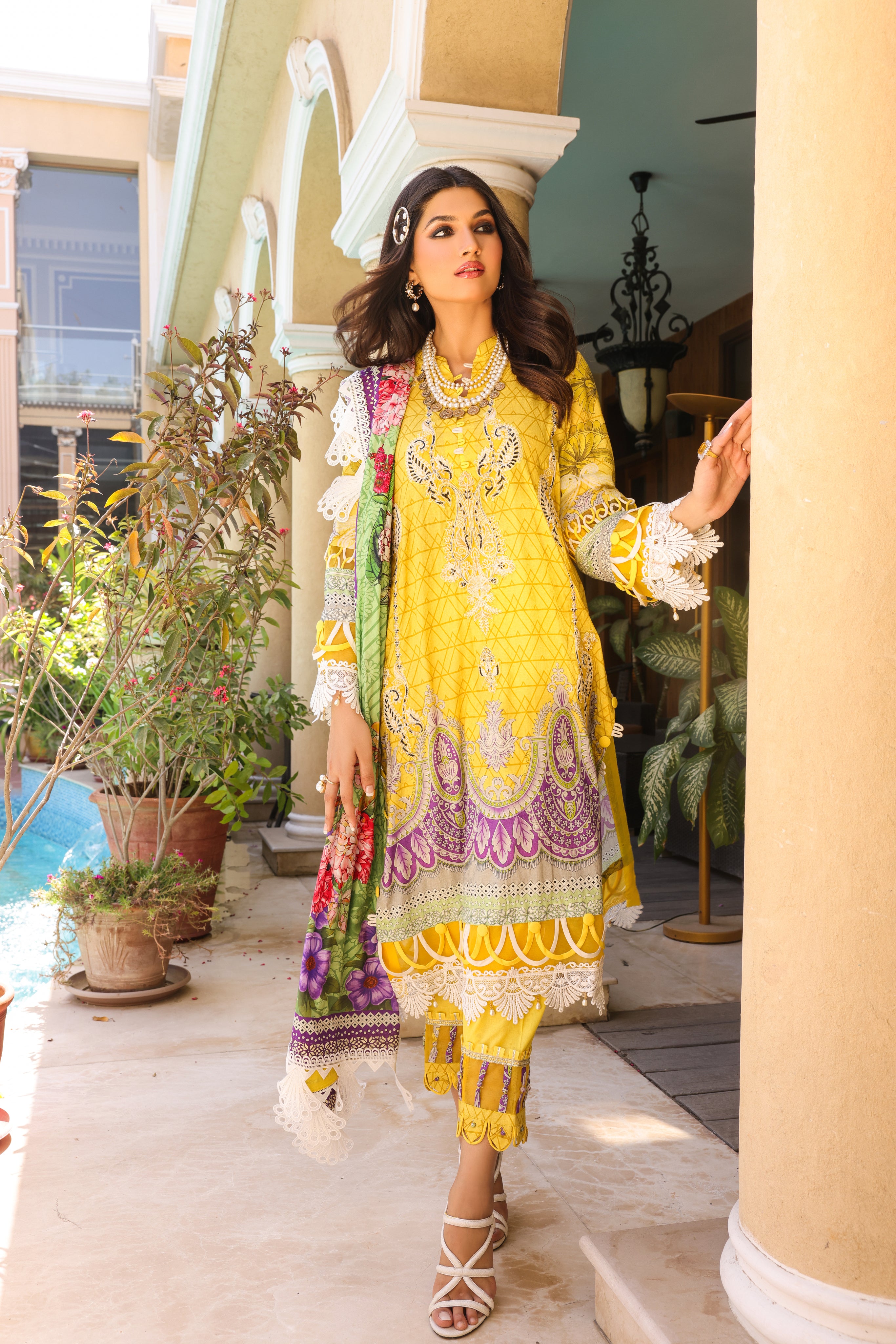 A girl is wearing 3 Piece Embroidered Organza Suit of Illuminating Yellow color.